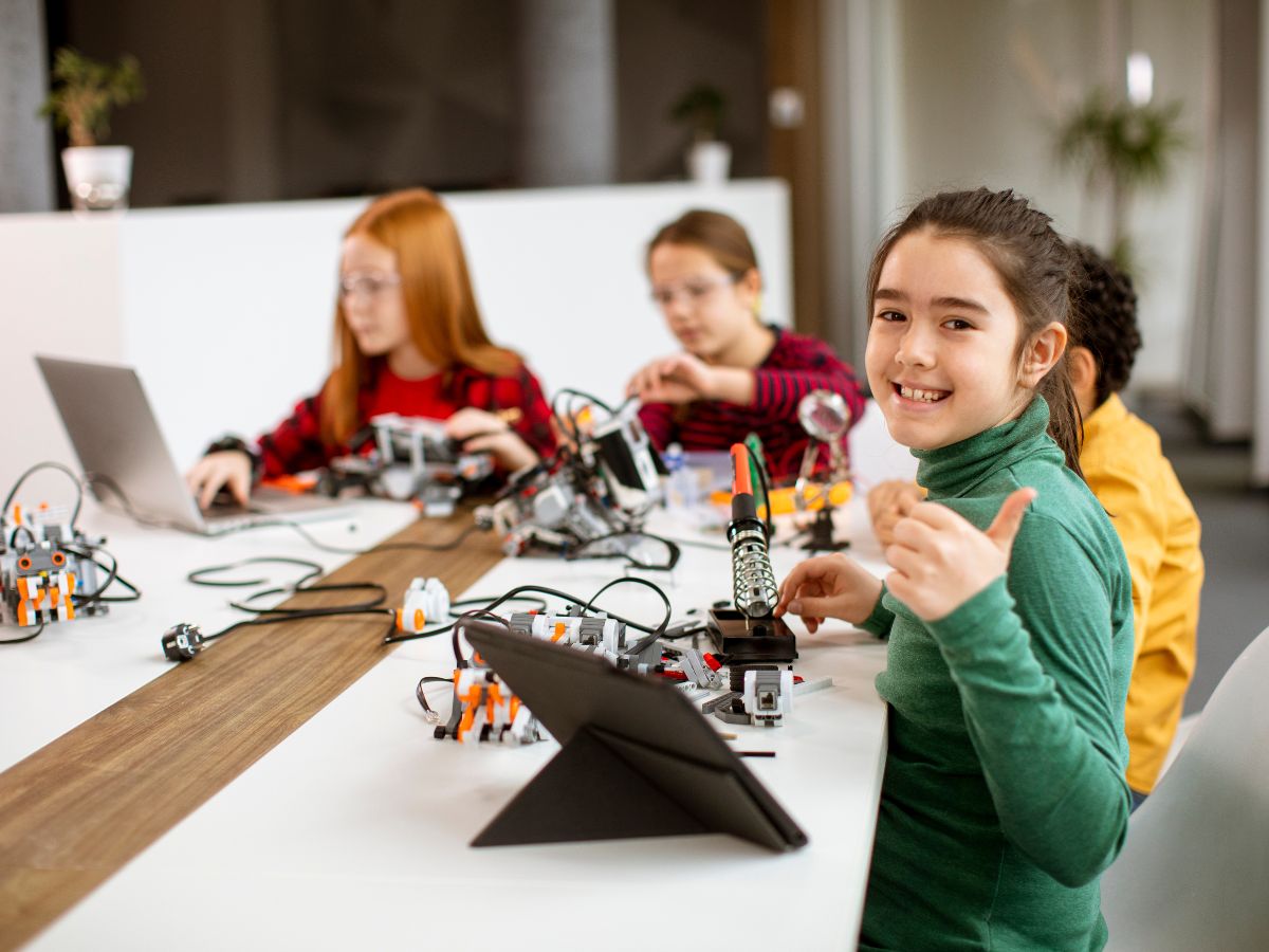 Girls collaborating on a coding activity as part of a Girls Code It Better sprint.